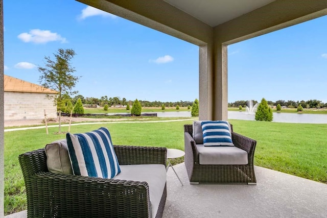 view of patio with a water view