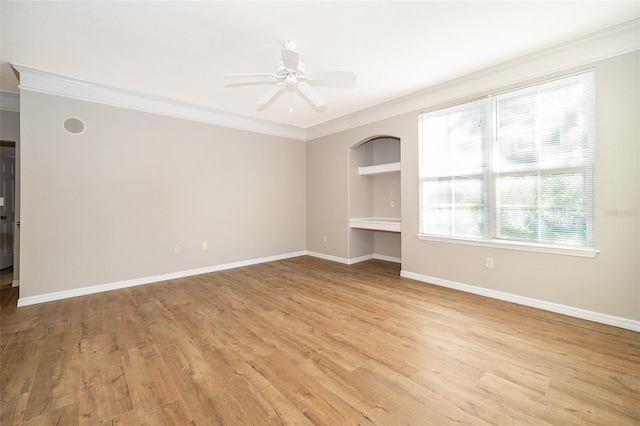 interior space featuring ceiling fan, light hardwood / wood-style floors, and ornamental molding