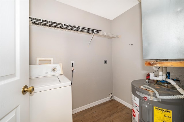 laundry area featuring water heater, dark hardwood / wood-style floors, and washer / dryer