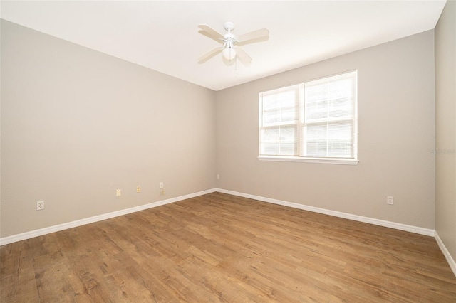 spare room featuring ceiling fan and light hardwood / wood-style flooring