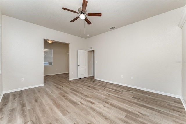 empty room with light hardwood / wood-style floors and ceiling fan