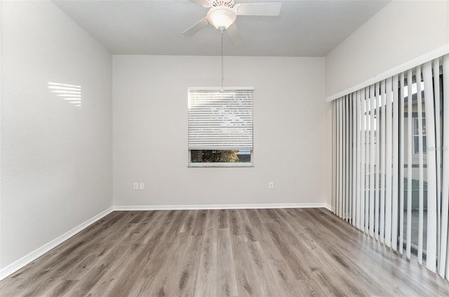 unfurnished room with light wood-type flooring and ceiling fan