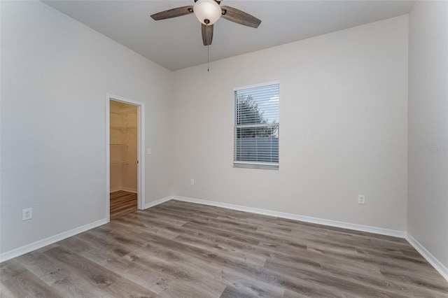 unfurnished room with ceiling fan and light hardwood / wood-style flooring