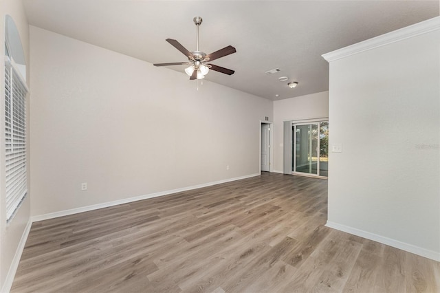 unfurnished room with hardwood / wood-style flooring and ceiling fan