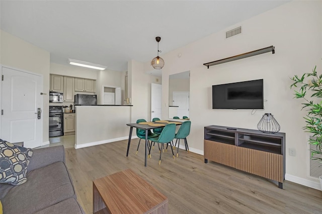 7383 Universal Blvd Unit 512, Orlando, FL 32819 - living area featuring light wood-style flooring and baseboards