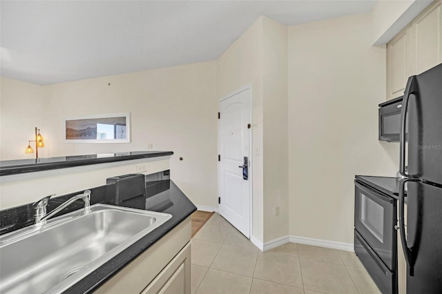 7383 Universal Blvd Unit 512, Orlando, FL 32819 - kitchen with black appliances, light tile patterned floors, and dark countertops