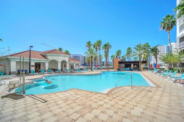 view of swimming pool featuring a patio