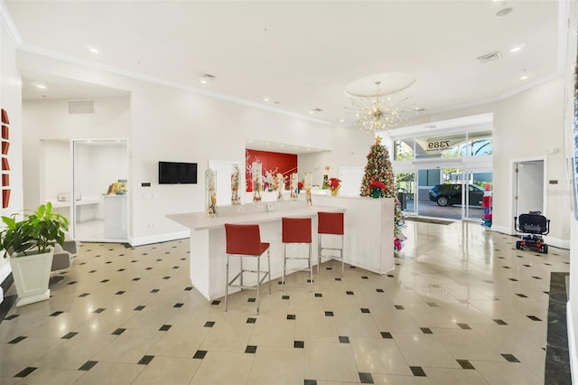 7383 Universal Blvd Unit 512, Orlando, FL 32819 - kitchen featuring open floor plan, crown molding, recessed lighting, a chandelier, and light countertops