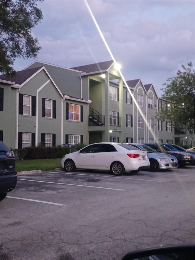 2035 Dixie Belle Dr Unit 2035A, Orlando, FL 32812 - view of property featuring uncovered parking