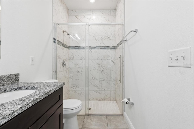 bathroom with tile patterned floors, toilet, an enclosed shower, and vanity