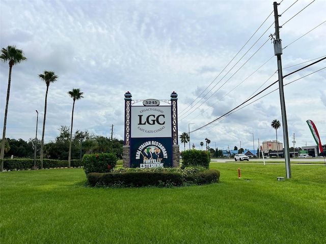 community / neighborhood sign with a lawn