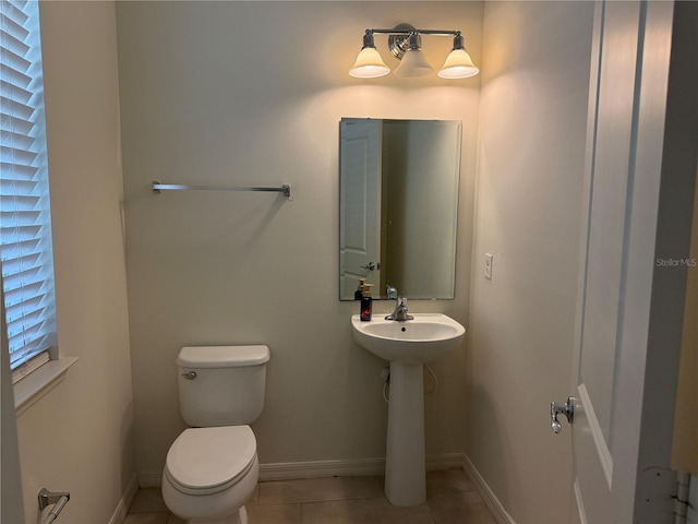 bathroom with tile patterned floors and toilet