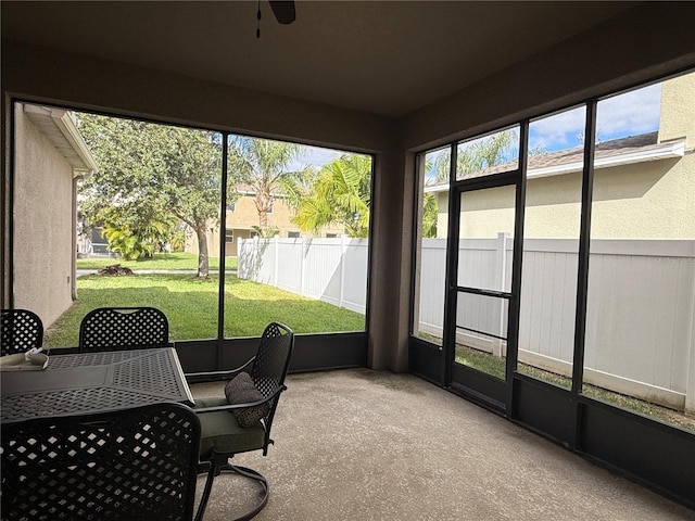 sunroom / solarium with ceiling fan