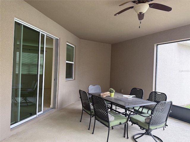 view of patio featuring ceiling fan