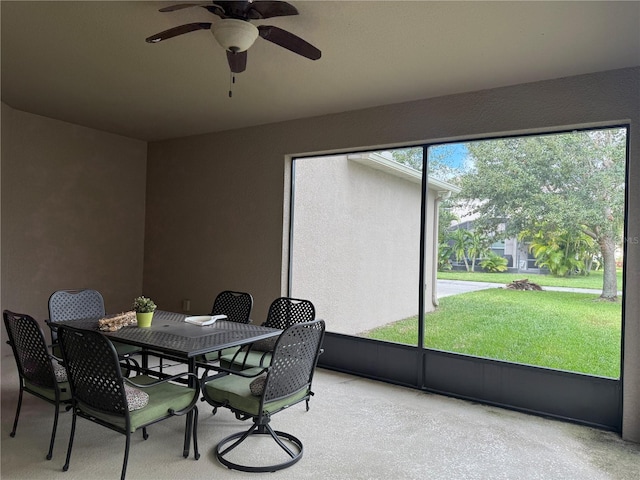 sunroom / solarium with ceiling fan