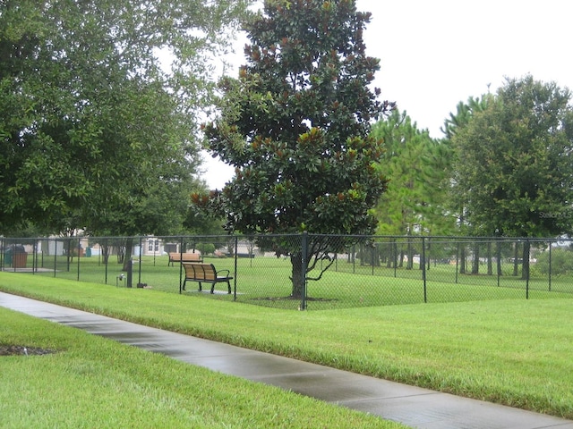 view of home's community featuring a yard