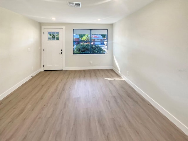 foyer entrance with light hardwood / wood-style floors