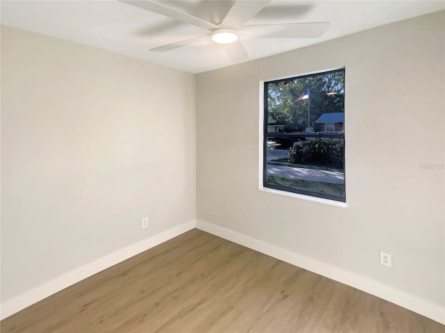 empty room featuring ceiling fan and wood-type flooring