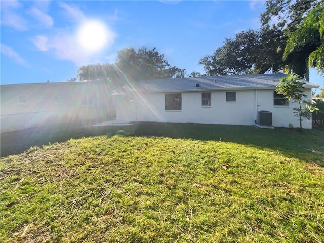 rear view of house with a yard