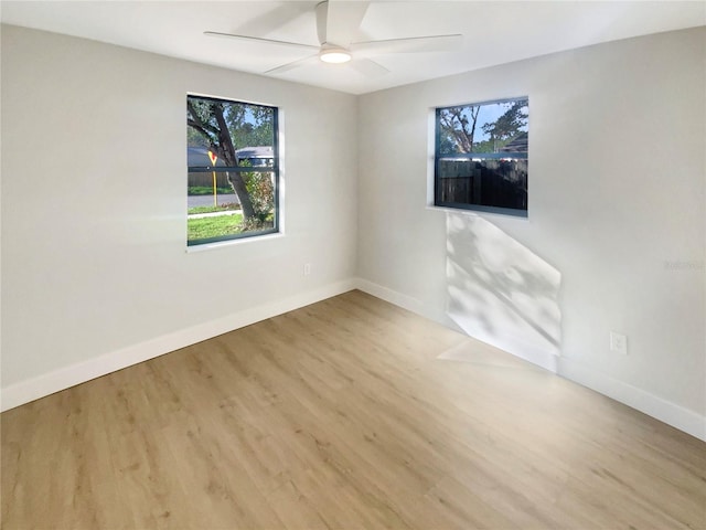 spare room with ceiling fan and light hardwood / wood-style flooring