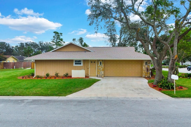 ranch-style home with a front yard and a garage