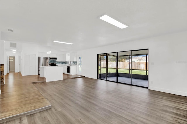 unfurnished living room with light wood-type flooring