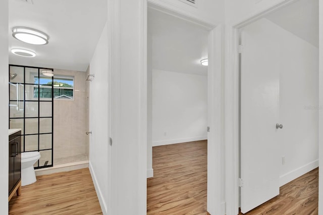 corridor featuring light hardwood / wood-style floors