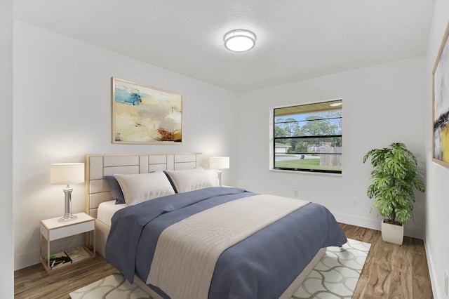 bedroom with light hardwood / wood-style flooring