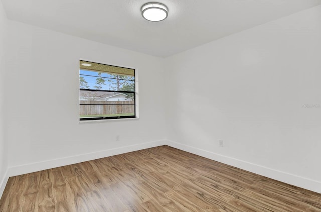 spare room featuring light wood-type flooring