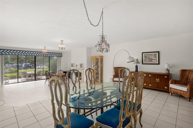 tiled dining space with a chandelier