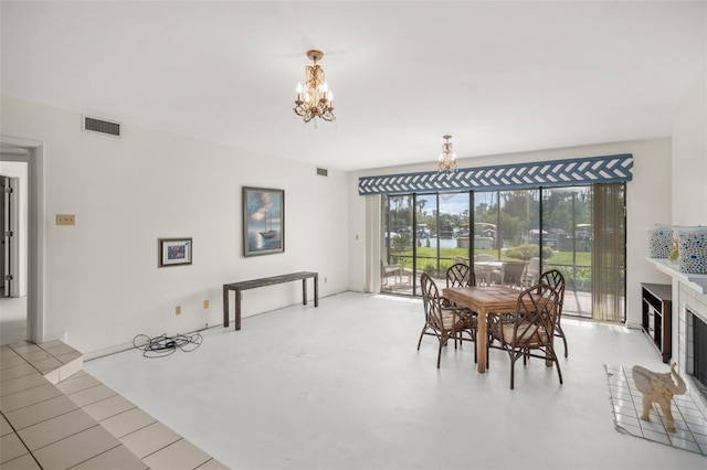 dining space with an inviting chandelier