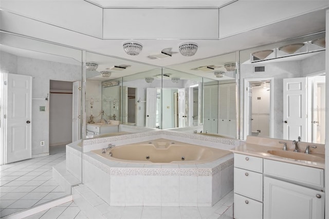 bathroom with shower with separate bathtub, vanity, and tile patterned floors