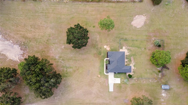 birds eye view of property with a rural view