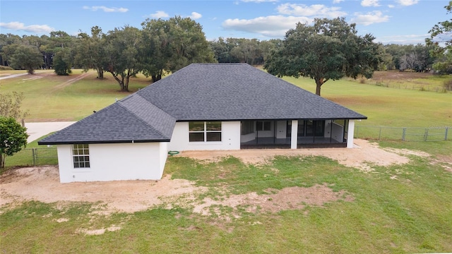 view of front of property featuring a rural view and a sunroom