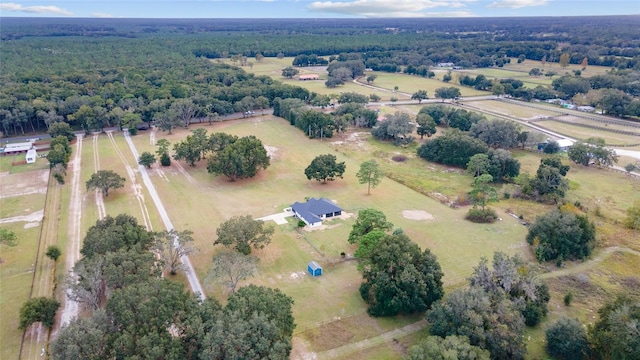 birds eye view of property with a rural view