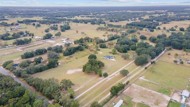 birds eye view of property with a rural view