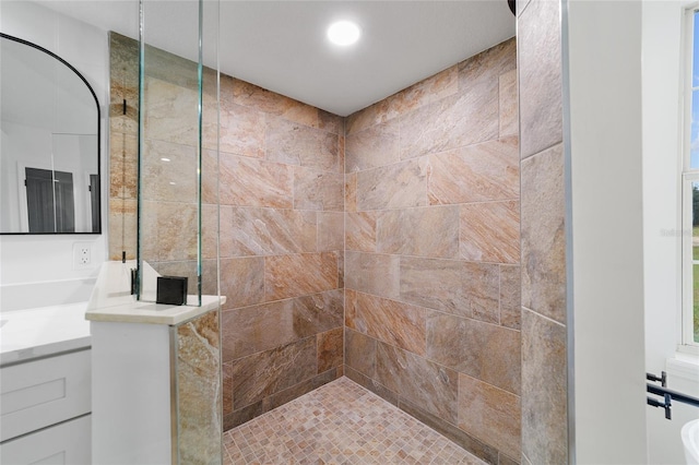 bathroom with tiled shower