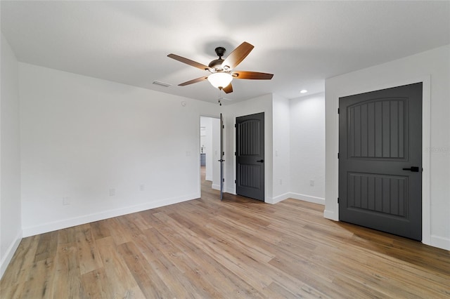 unfurnished bedroom with ceiling fan and light hardwood / wood-style floors