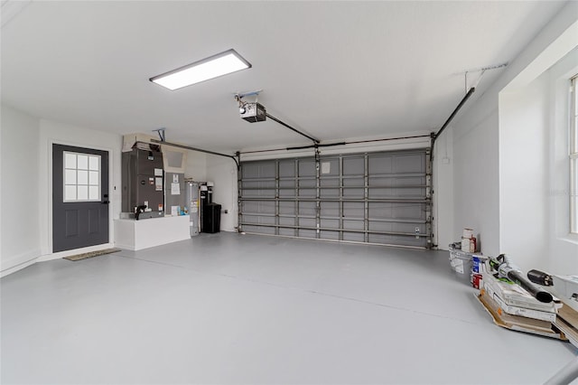 garage with heating unit, water heater, and a garage door opener