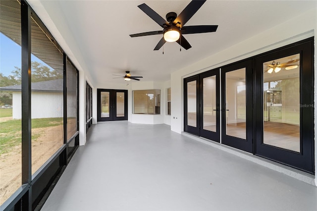 unfurnished sunroom with french doors