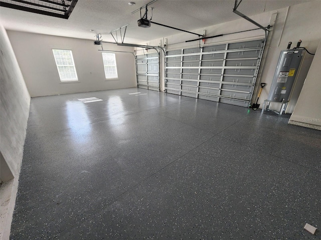 garage featuring electric water heater and a garage door opener