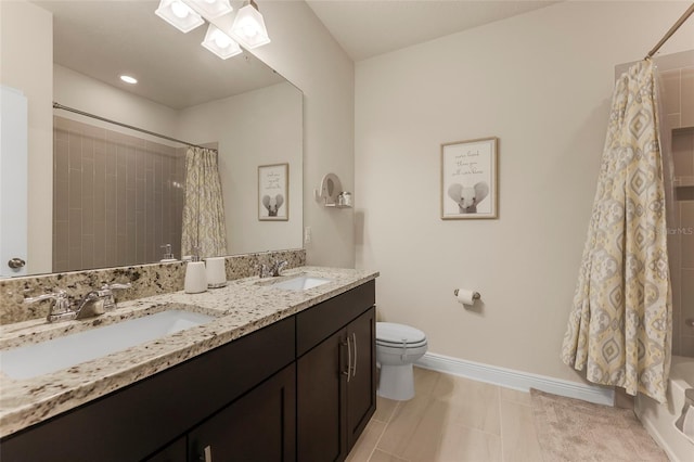 full bathroom featuring tile patterned floors, vanity, toilet, and shower / bath combo with shower curtain