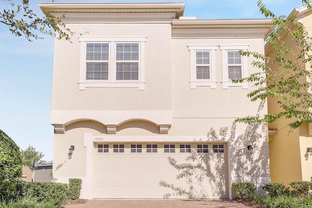 view of front of property with a garage