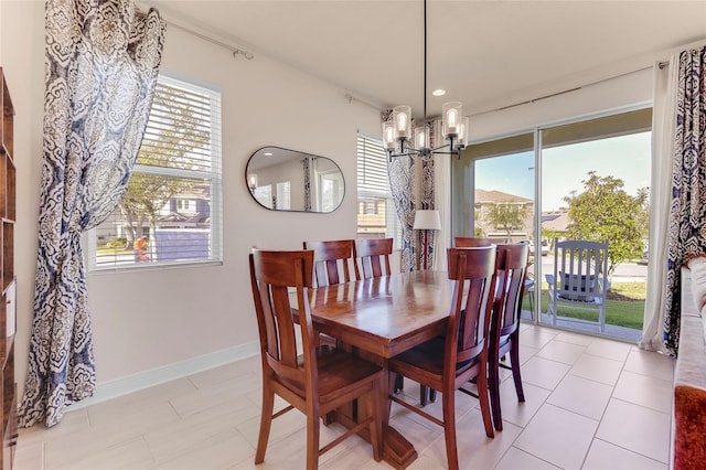 tiled dining space with a notable chandelier