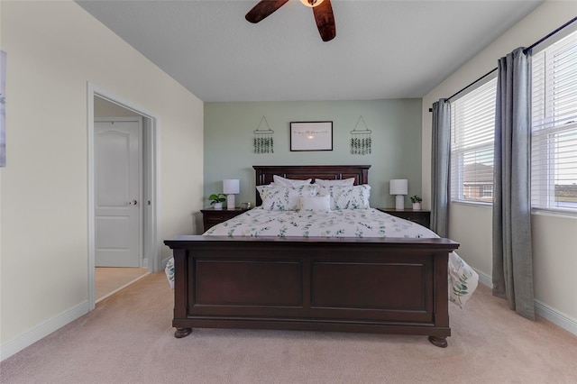 bedroom with light colored carpet and ceiling fan