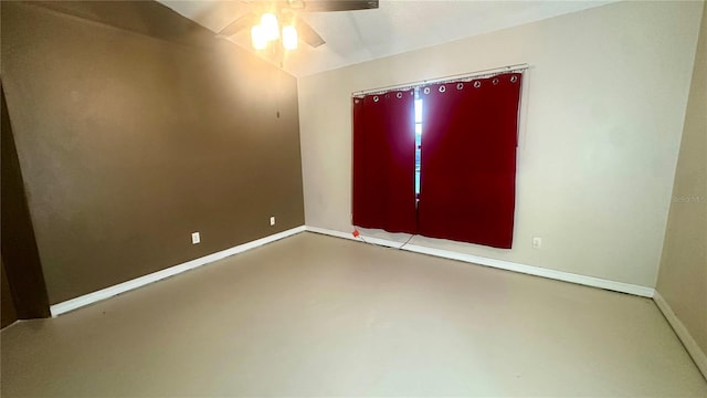 spare room featuring ceiling fan and concrete flooring