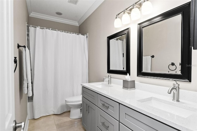 bathroom featuring tile patterned floors, vanity, toilet, and ornamental molding