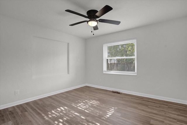 empty room featuring ceiling fan and wood-type flooring