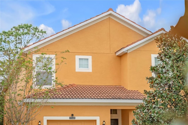 view of side of home with a garage