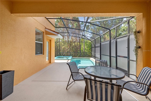 view of patio with a pool with hot tub and a lanai